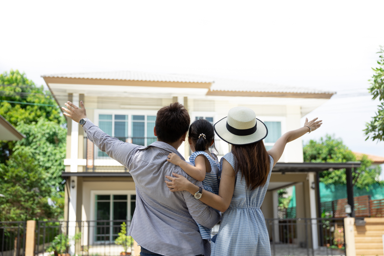 happy-asian-family-father-mother-daughter-near-new-home-real-estate-2-1